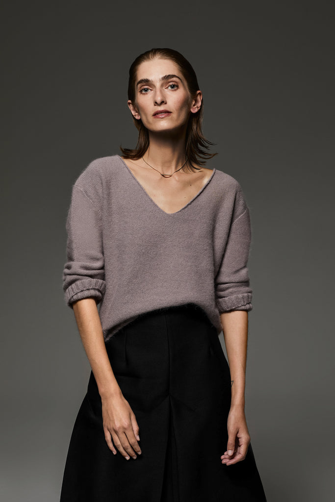Detail of the dropped shoulders on the Angelina V-neck angora-wool sweater