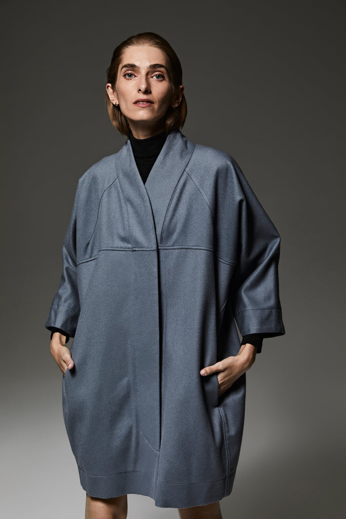One-seam inspired coat in ocean grey wool, featuring a refined cocoon silhouette